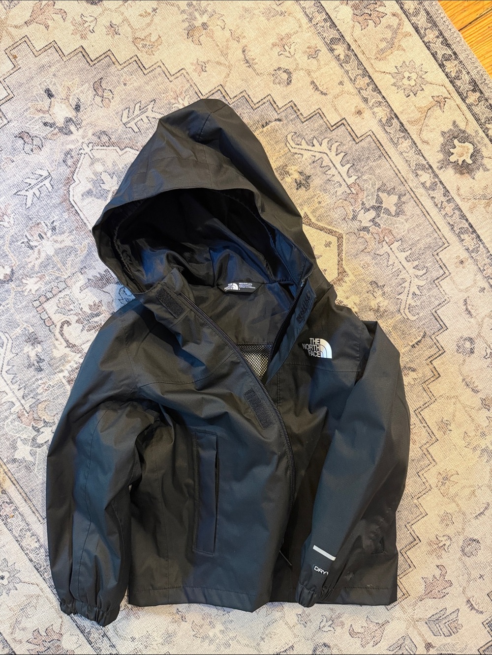 The North Face Kids Black Hooded Raincoat with Reflective Accent